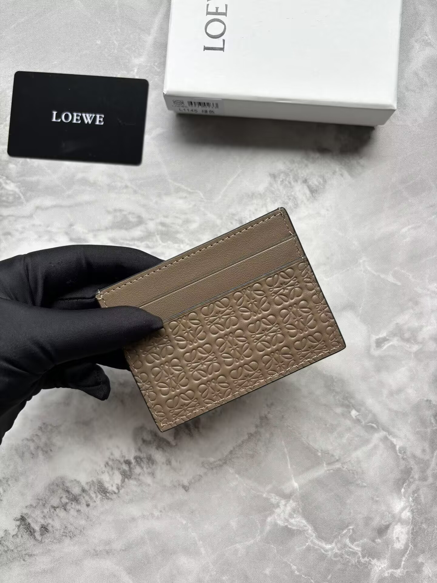 L0ew* cardholder