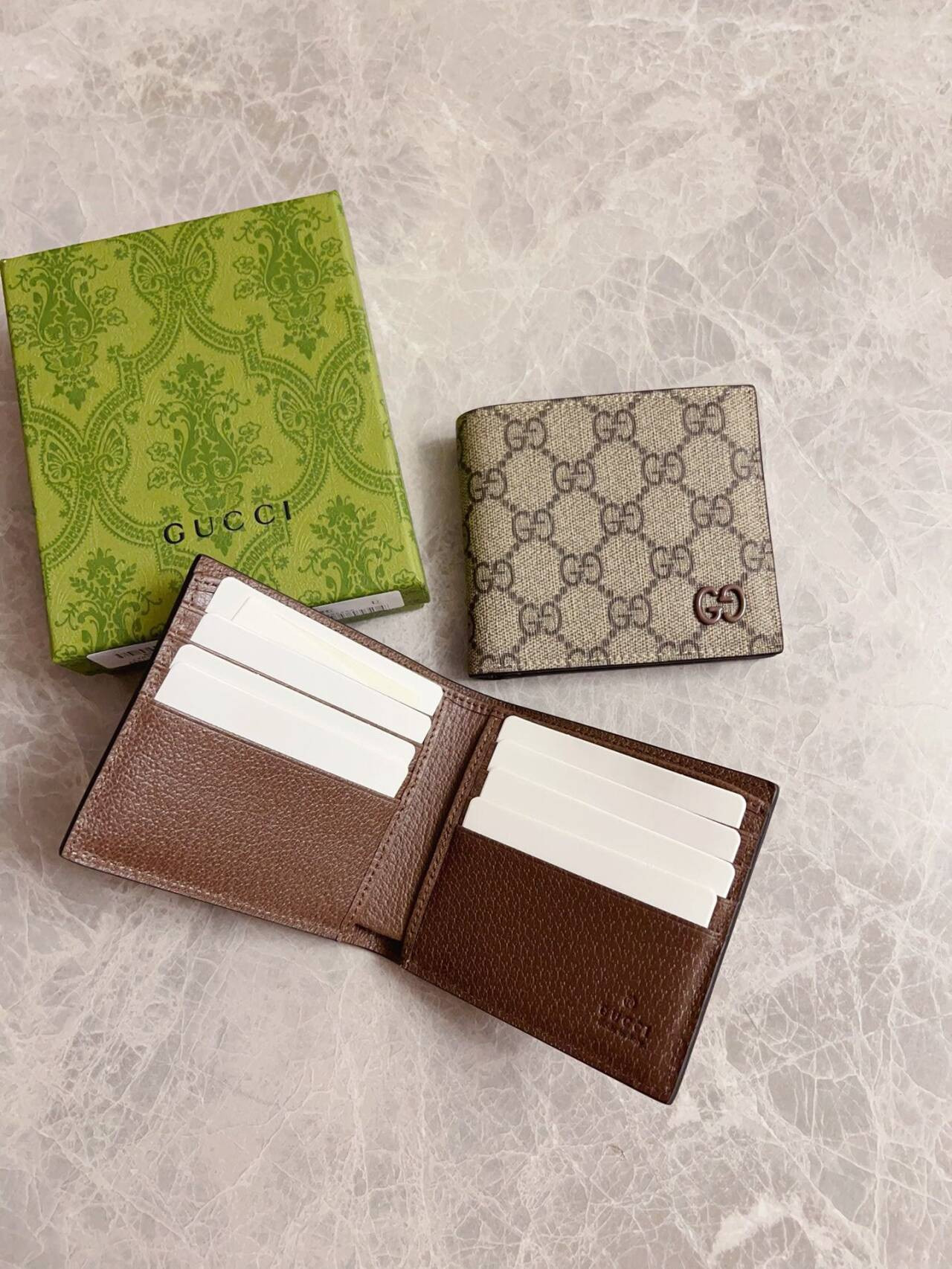 G*u*i brown interior gg bi-fold wallet 10x8.9cm