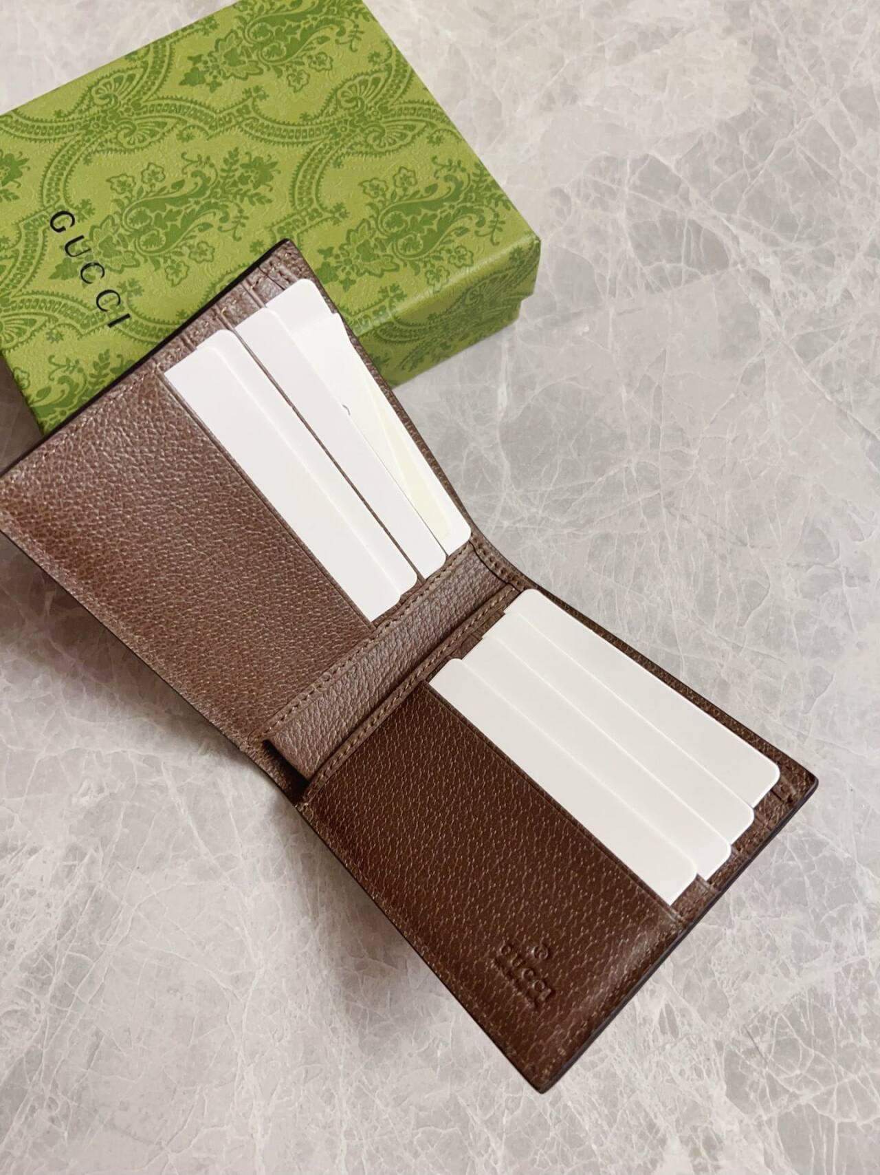 G*u*i brown interior gg bi-fold wallet 10x8.9cm