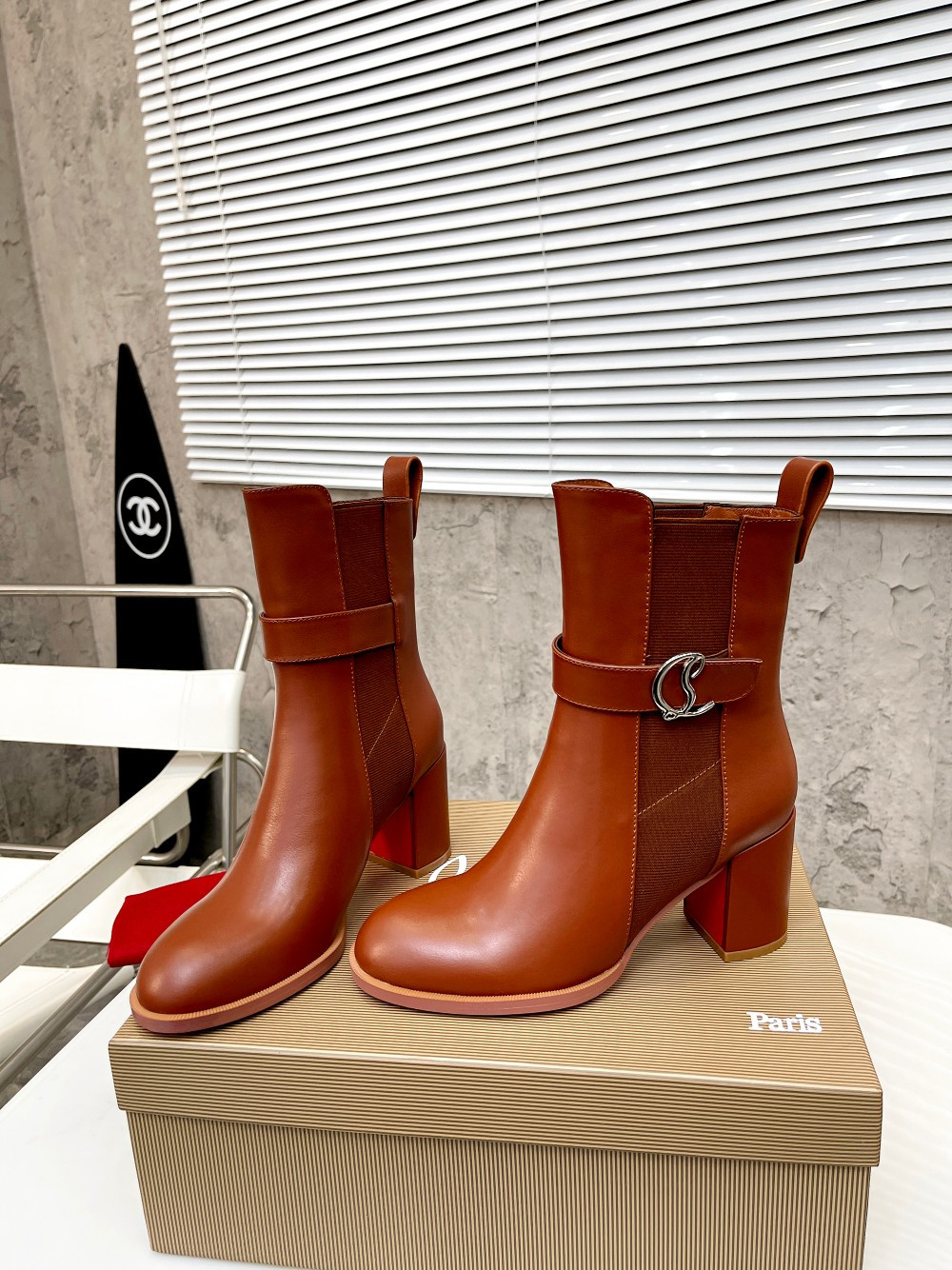 UA Ch**an Louboutin (CL) launched a new collection of chunky heeled platform boots