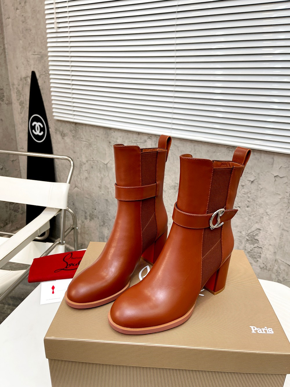 UA Ch**an Louboutin (CL) launched a new collection of chunky heeled platform boots