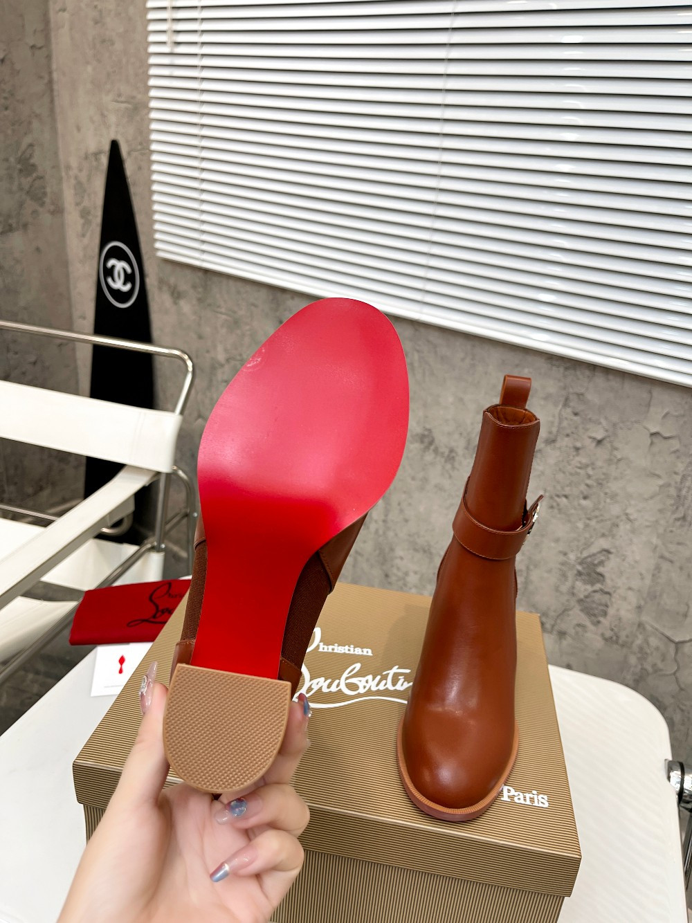 UA Ch**an Louboutin (CL) launched a new collection of chunky heeled platform boots